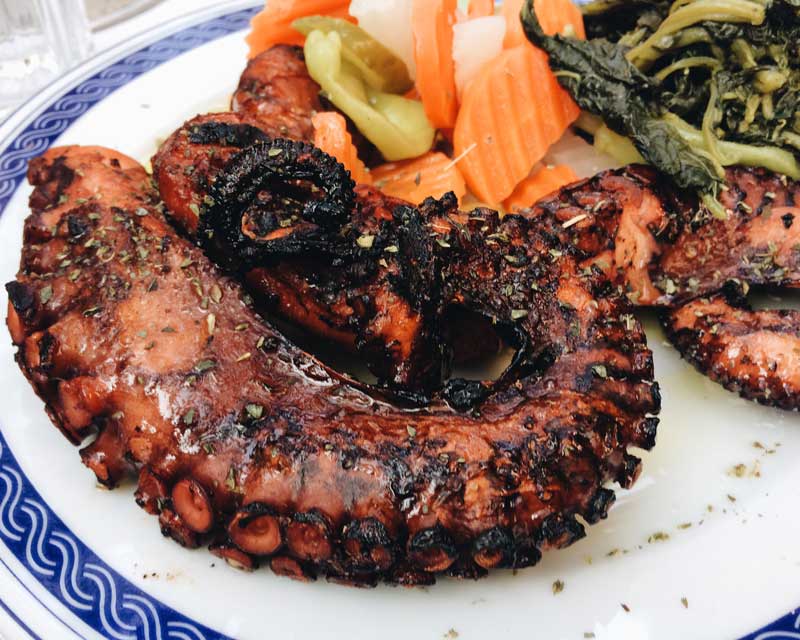 grilled-octopus-on-the-plate-with-pickled-vegetabl-95KHDBZ